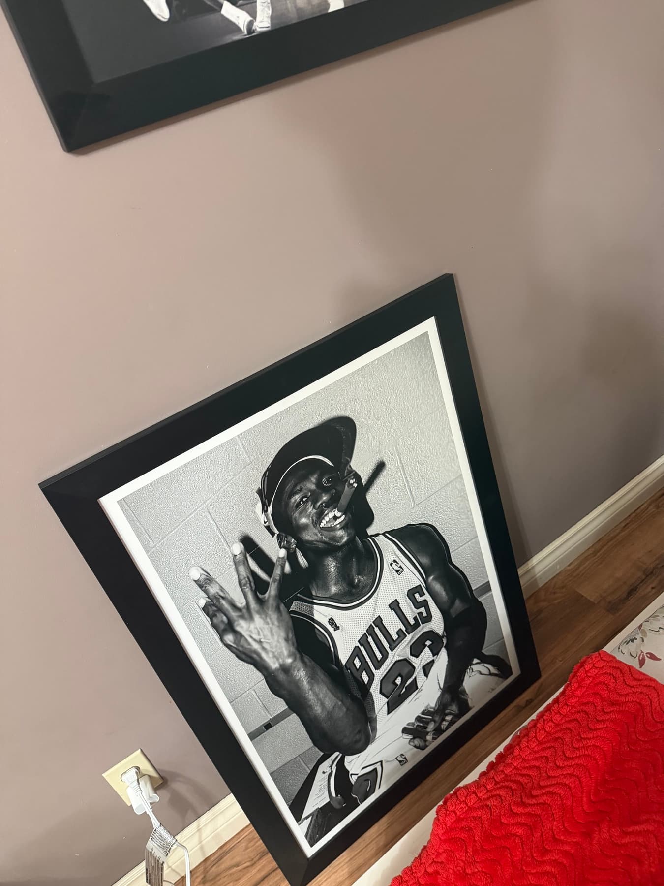 Framed black and white photo of Michael Jordan in a Bulls jersey celebrating with a cigar