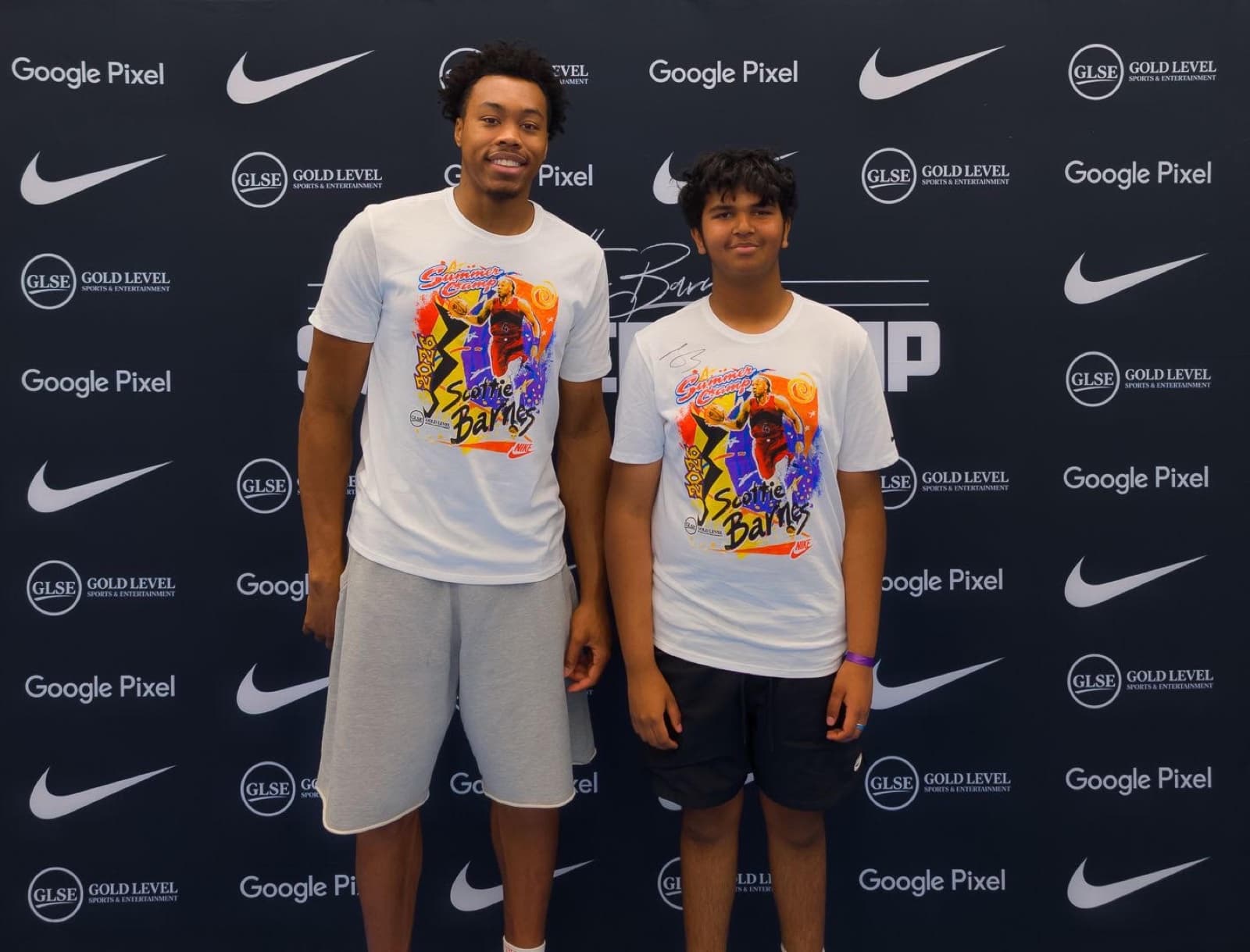 Mir Kahol meeting Scottie Barnes at a basketball event